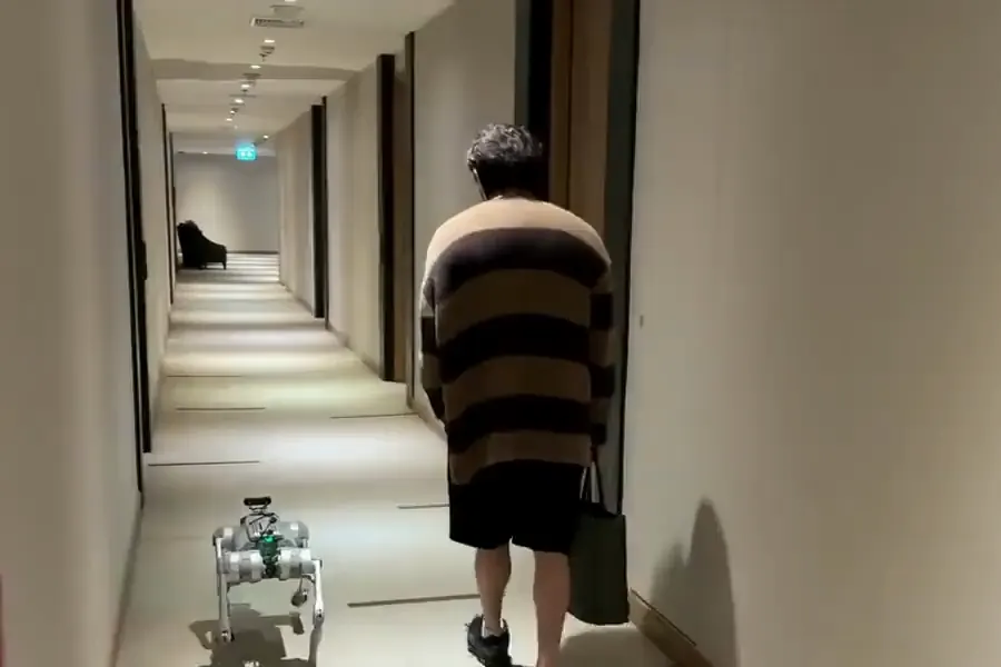 Real footage: our robot following a person down a building corridor